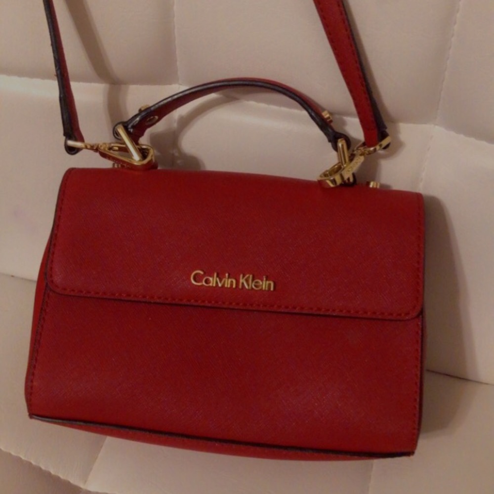 Bright red Calvin Klein handbag .